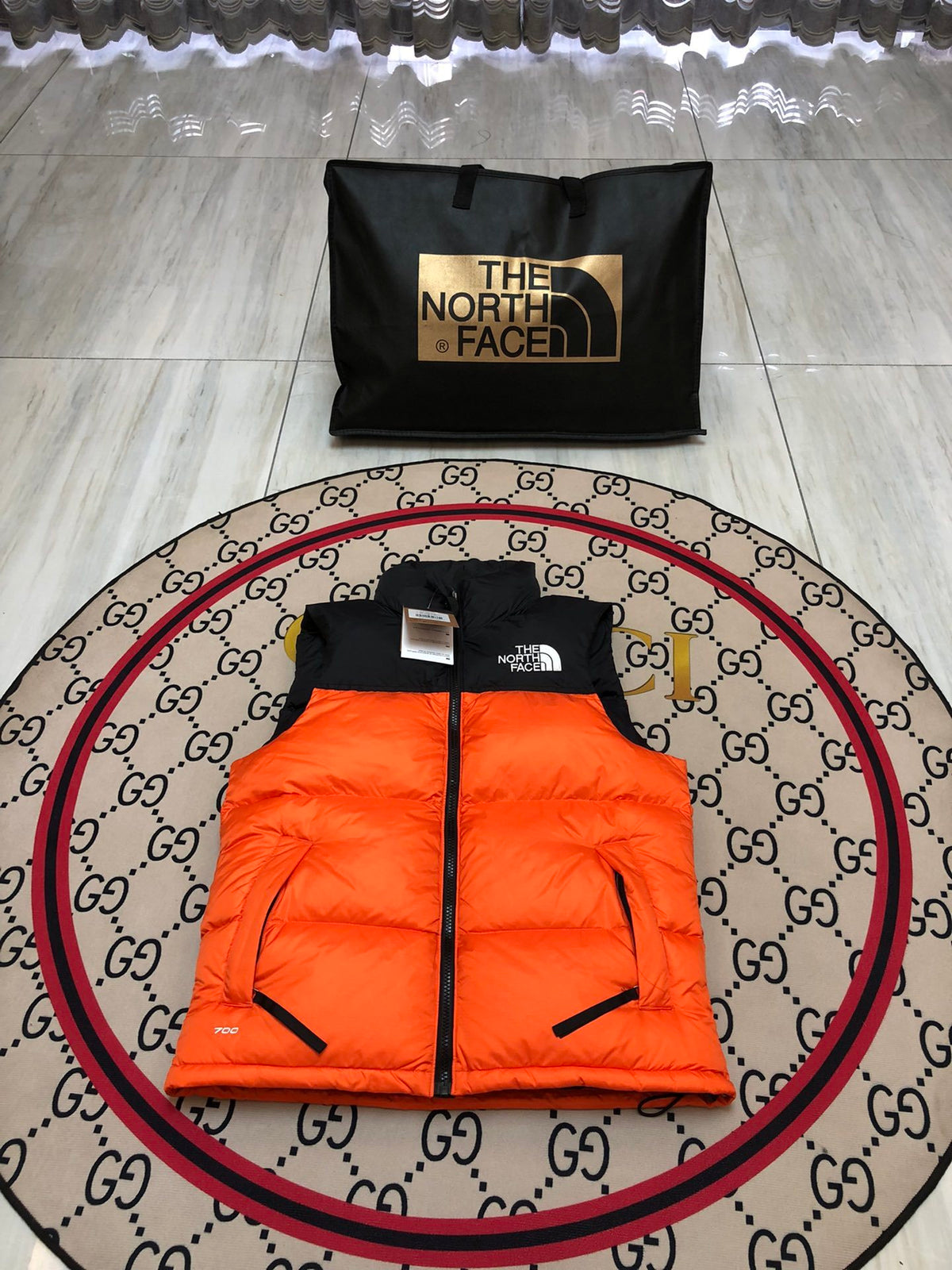 The North Face Orange and Black Colorblock Puffer Vest